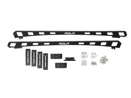 Black Rola vehicle roof rack system with mounting hardware on a white background