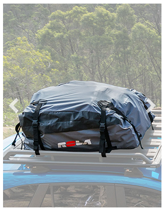 Roof rack with a black bag on a vehicle, set against a natural background.